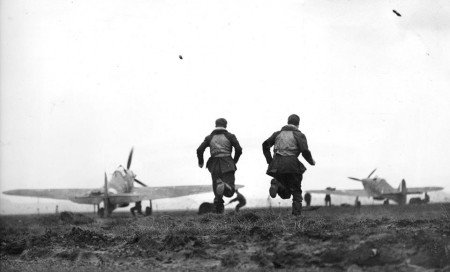 RCAF pilots run towards their waiting Hurricanes in this incredible photograph taken during the height of the Battle